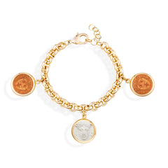 Gold chain bracelet with coin charms on a white background