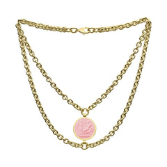 Gold chain necklace with a pink pendant on a white background